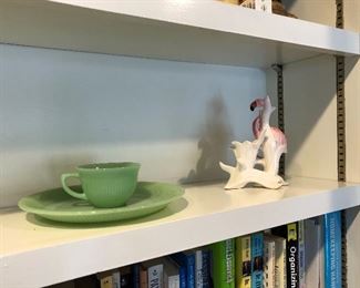 a couple pieces of jadeite and flamingo figurine