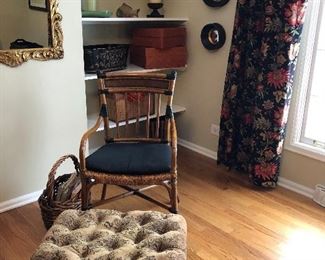 pretty home decor includes a rattan chair and tufted foot stool