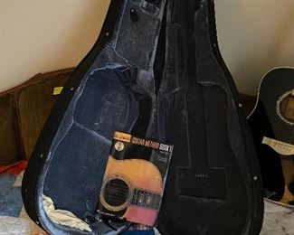 Guitar case with beginner book 