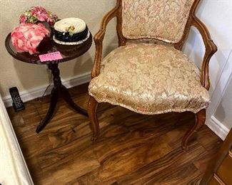 French arm chair, mahogany small round table, vintage hats