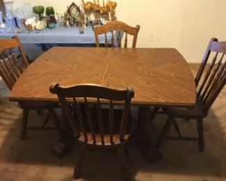  Table without  leaf. It comes with five chairs and one captain chair.