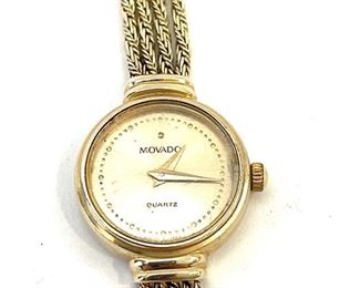 Movado 14k Gold Ladies Dress Watch	Face: 18mm diameter   Sz: 6.5-6.75 adjustable