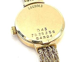 Movado 14k Gold Ladies Dress Watch	Face: 18mm diameter   Sz: 6.5-6.75 adjustable