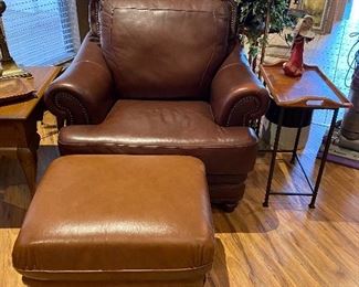 Leather arm chair & unmatched ottoman, ficus trees...