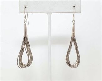 448	

VTG Navajo Native American Sterling Silver Liquid Silver Dangle Earrings ~ Sunrise Mark, 4.8g
Wonderful pair of Native American dangling liquid silver earrings ~ sterling silver ~ 2" long, wire hook. Clearly marked with sterling & sunrise.
Weighs Approx 4.8g .