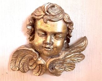 $35 Gilt angel head with wings.   7" H,8" W, 3" D. 