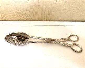 $25 Tongs silver tone with design.  8" L.  