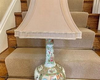 $250  - Rose medallion lamp  on gilt stand with shade and stone filial.  27.5" H, base 8.5" diam.