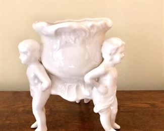 $30  - Porcelain figures carrying vase 5" H, 3.5" diam.