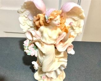 $20 Angel statue pastel colors.   7.5" H, 5.25" W, 3" D.
