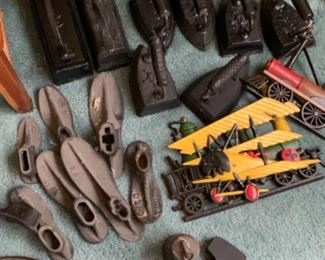 50 to 60 pc of antique cast iron - pea, shoe molds w/ stands sad irons up to 20 lbs   