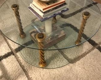 Glass coffee table with gold pillars $150