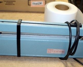 ULine 12" Impulse Sealer With Cutter, Model H-293, Includes Plastic Tubing Material, Qty 1 Partial And 1 Full Roll