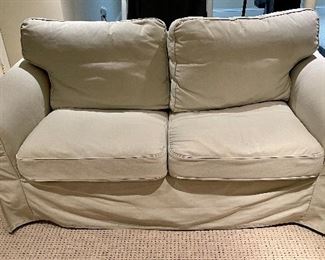 Ivory slip covered love seat by Ikea