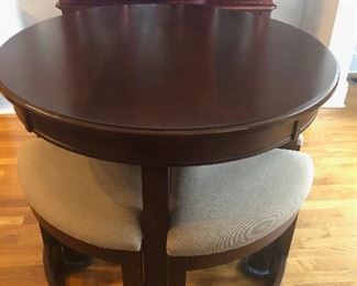 Tall bistro table with slide under chairs