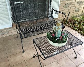 Wrought iron bench with coffee table