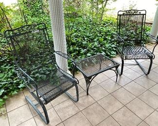 2 wrought iron rocker chairs and small table