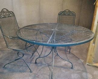 Wrought iron table - has 4 chairs