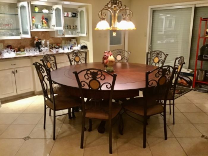 Beautiful Round Dining Table, Seats 8, Leaves fold and Store under Table for a smaller size 