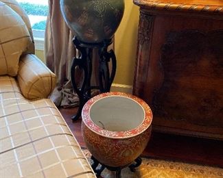 Asian pots on wooden stands