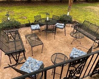 Lots of wrought iron furniture 