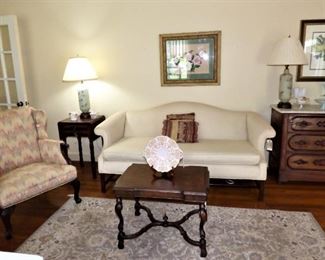 Camel back sofa, Carved arm chair, drop side antique table, 
