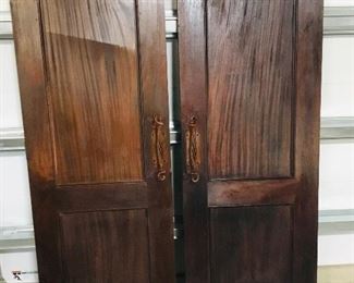 Double entrance doors with nice handles. Include double door frame. Believed to be mahogany.