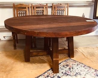 Teakwood round table. 61” wide. 31” tall. 2.5” thick. 