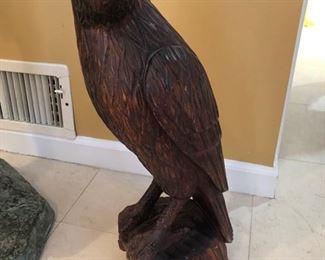 Wood carved eagle with brass beak