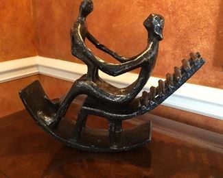 Cast metal sculpture - parent and child on rocking chair