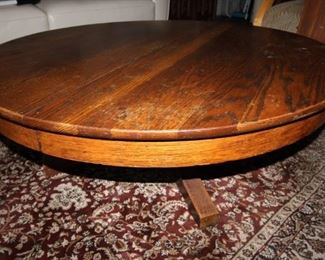 $150. Pedestal coffee table with three leaves. 45 inch diameter. 3x10 inch leaves.