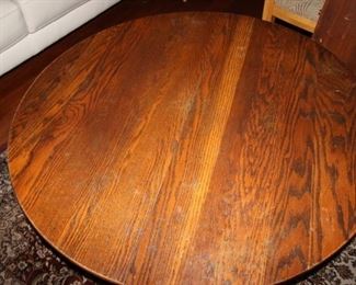 $150. Pedestal coffee table with three leaves. 45 inch diameter. 3x10 inch leaves.
