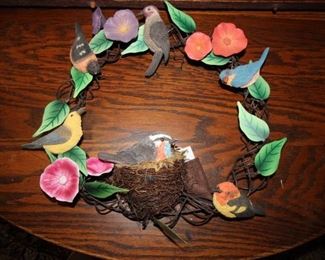 $25. Colorful resin bird wreath with sounds.