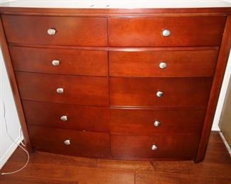 $375. Ten drawer cherry colored tall chest of drawers, 58x20x45.