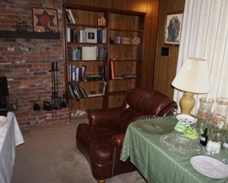 Leather club chair $65,                                                                     
 sad irons, fire place tools,  books shelf items Abe Lincoln by Carl Sanburge