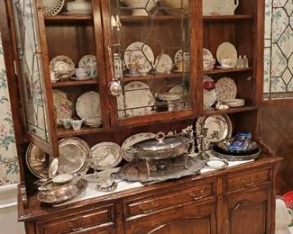 Sideboard/china hutch with leaded glass doors. Belleek scallop teacups with luncheon plates; Porcelain teacups - Monticello, royal Chelsea, Queen Anne, DW Porzellan  Vieux Rembrand, royal Albert Lorraine, Schwartzenhammer, Haviland Gramercy, Fenton, Wedgwood, D&Co France, Hammersley Victorian, Shelley; Antique plates - Royal Winton, Enoch Wedgwood; Lots of silverplate - trays, bowls, shells, chafing dish