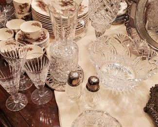 Waterford Tramore champagne glasses; Block cut crystal hurricane candleholders (2); crystal biscuit jar; Cristal D'arques large cut crystal bowl