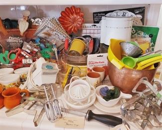 Vintage and modern bakeware - large gingerbread cookie cutters, mixer, copper bowl, juicer, cookie presses, vintage Pyrex, sifters and lots of miscellaneous items