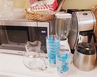 Panasonic 1200w microwave; Oster blender (1 of 2); Cuisinart Grind and Brew coffee maker and extra carafe