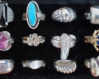 Sterling & onyx, turquoise, pearl, amethyst rings. Center right is an 18k gold ring with enamel scarab