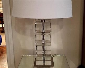 Mirrored side table; glass block lamp.