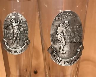 Additional view of pewter emblems on pilsner glasses