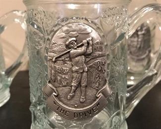 Additional view of pewter emblem on mugs