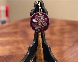 Purple tassel ornament, $4