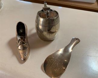 $45 3 1/2'' Antique English sterling shoe with monogram (probably a pin cushion originally); $45 antique S/P mustard pot with monogram; $60 Antique English sterling shoe horn with Monogram