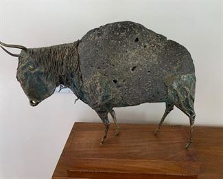 $295 Ernest Badynski (1934-2011) stone and copper bison sculpture 19'' x 12 1/2'', 13 1/4'' x 6'' wooden base