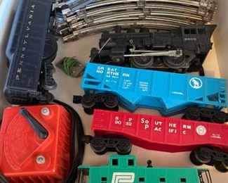 Assorted trains tracks and a lamp