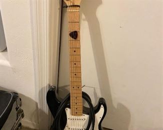 Starcaster Electric Guitar by Fender and a Peavey Amplifier and microphone