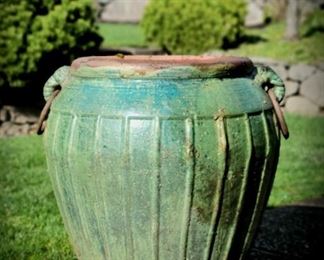 large glazed pottery planter with iron handles
