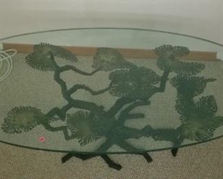 This is a very rare, probably one of a kind, brass Bonsai tree base and an oval glass top table. This item was made in the 1970's, possible by Willy Daro, according to the owner